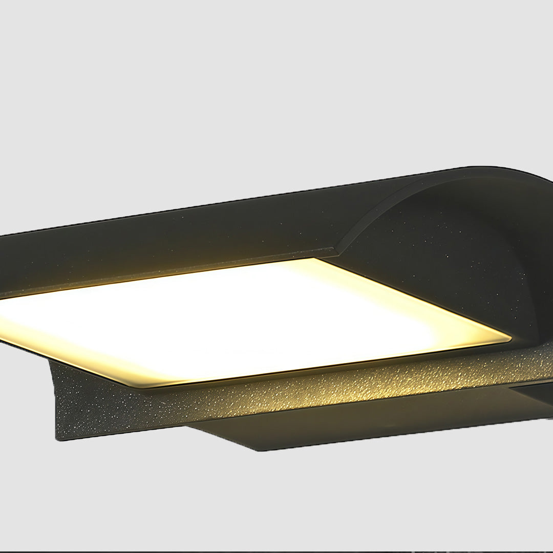 Closeup-exterior down wall lights mounted on wall demonstrating warm downward light distribution.