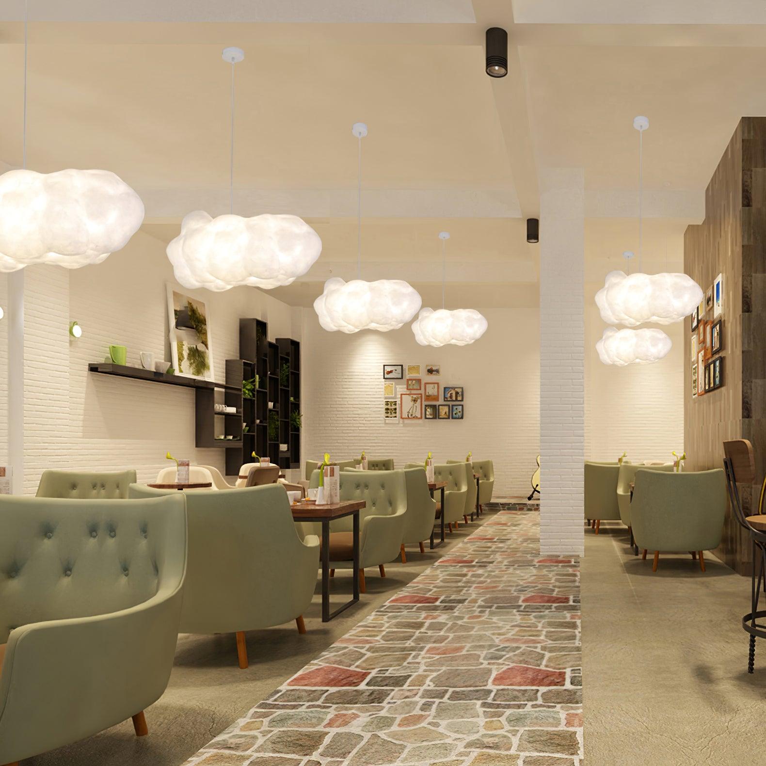Cloud pendant lights creating ambient lighting in a modern cafe interior.