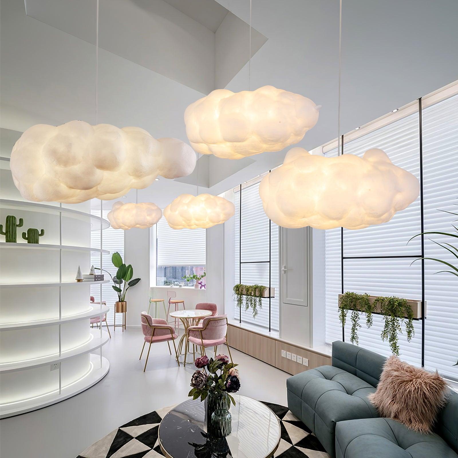 Multiple cloud pendant lights installed in a bright contemporary open-plan interior.