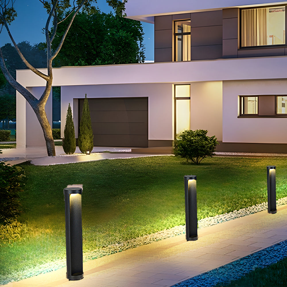 Commercial LED bollard lights enhancing a minimalist garden with soft light.
