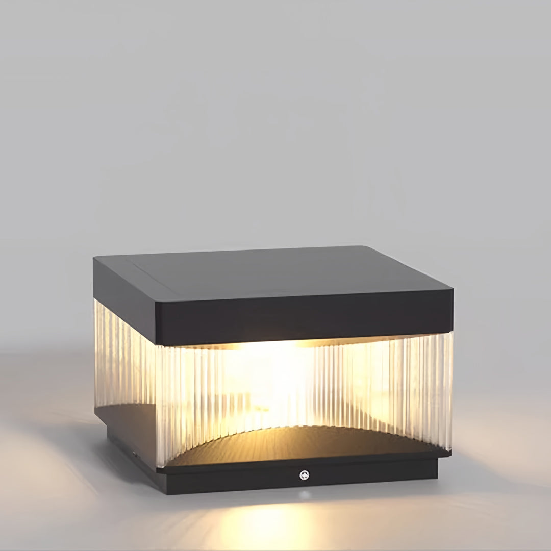 Compact square pillar lights with ribbed diffuser displayed on neutral background showing detail