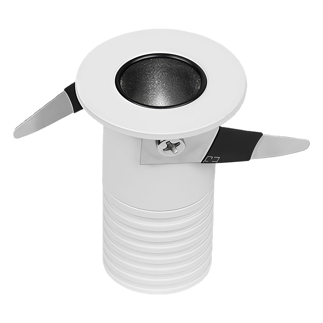 Compact white recessed ceiling spotlight with round bezel and spring-loaded mounting clips.