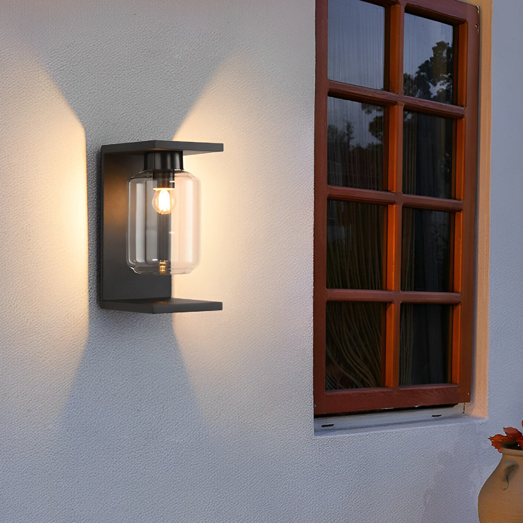 Compound wall lights outdoor with a close-up of their illuminated glass panels.
