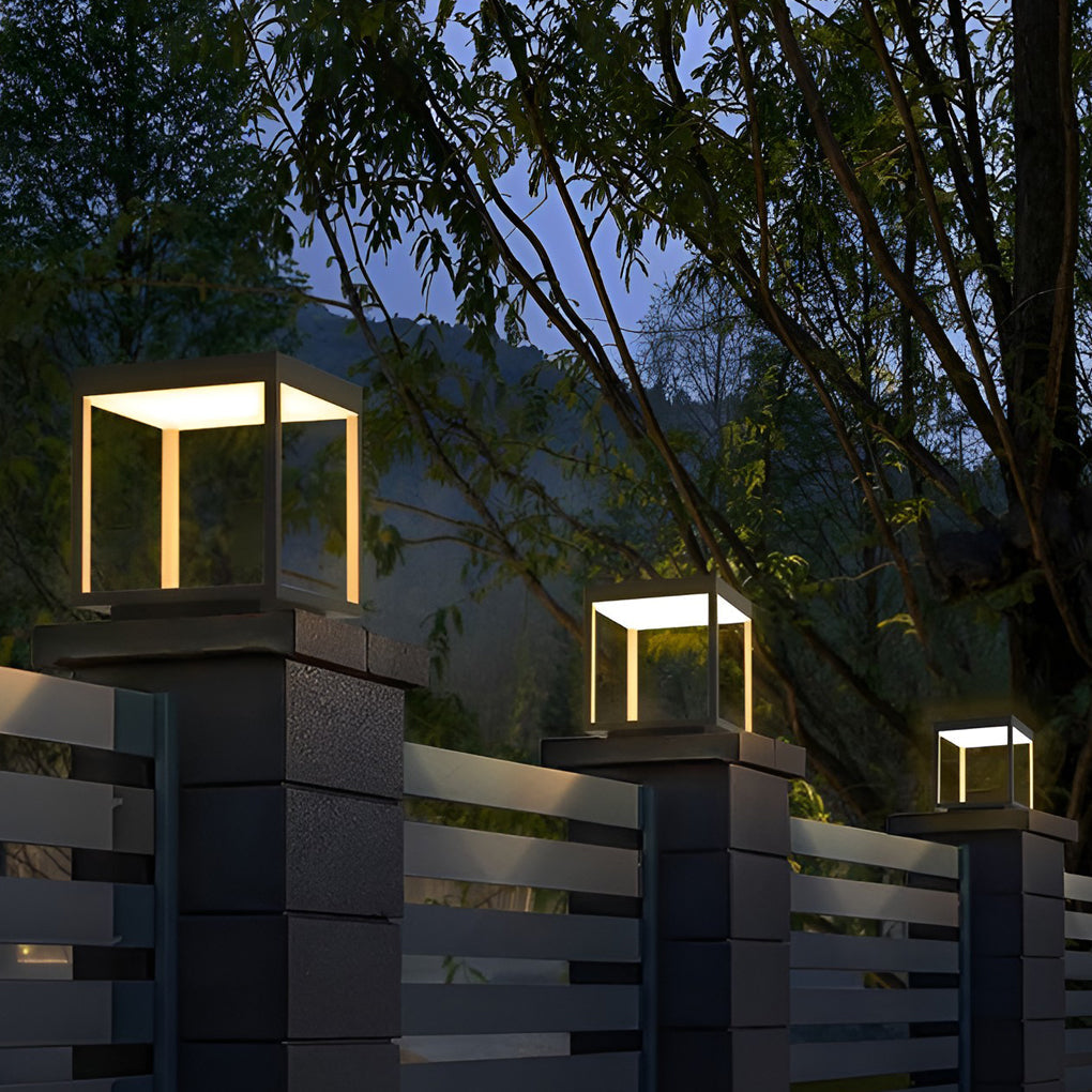 Modern concrete pillar lights installed along an outdoor fence