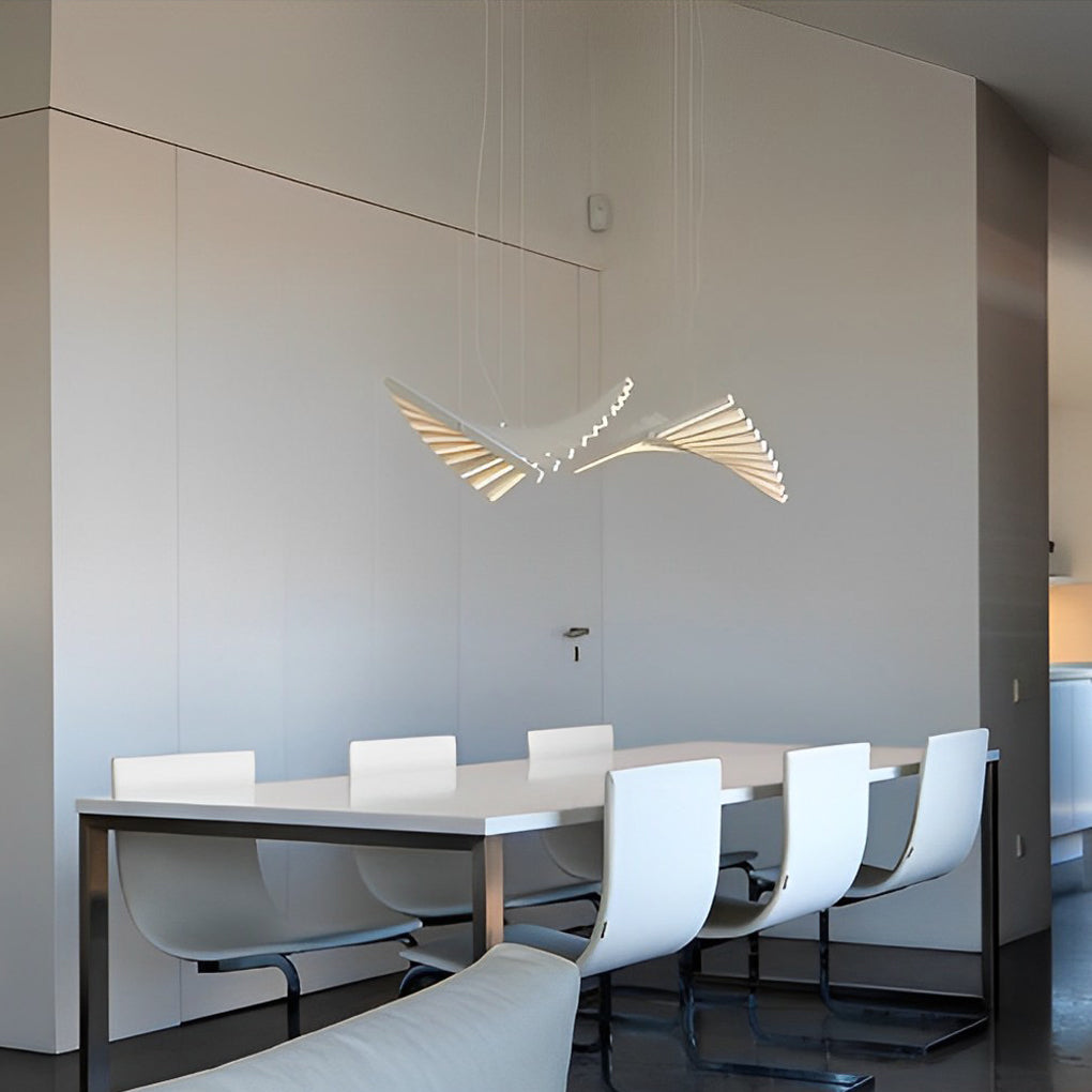 Contemporary black art pendants light adding sophistication to a minimalist dining space.