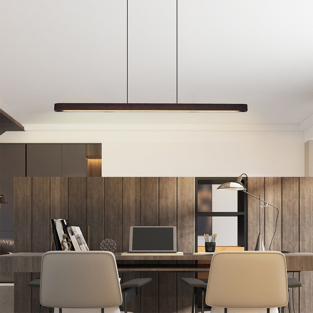 Elegant linear LED pendant lighting hanging above dining table, combining functionality and modern design.