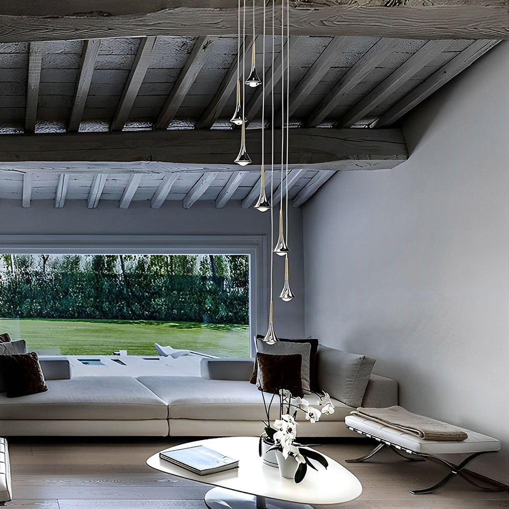Contemporary mini pendant lights hanging in an open-plan living area, complementing modern furniture and architecture.