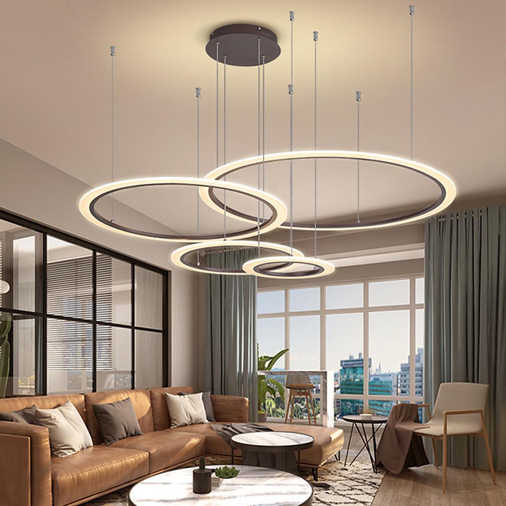 Contemporary multi ring chandelier lighting a stylish lounge area.