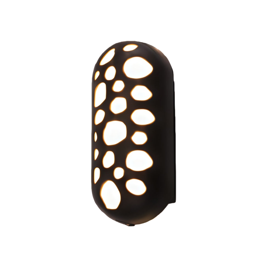 Contemporary outdoor up down wall lights with glass shade chandelier aesthetic in elongated black housing with decorative perforations.