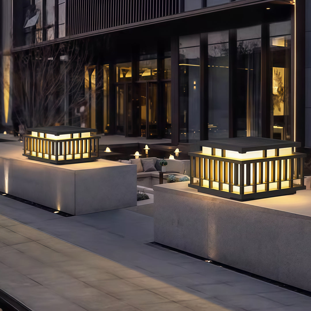 Contemporary outdoor wall lighting pillar mounted fixture with contemporary slatted design and horizontal black top
