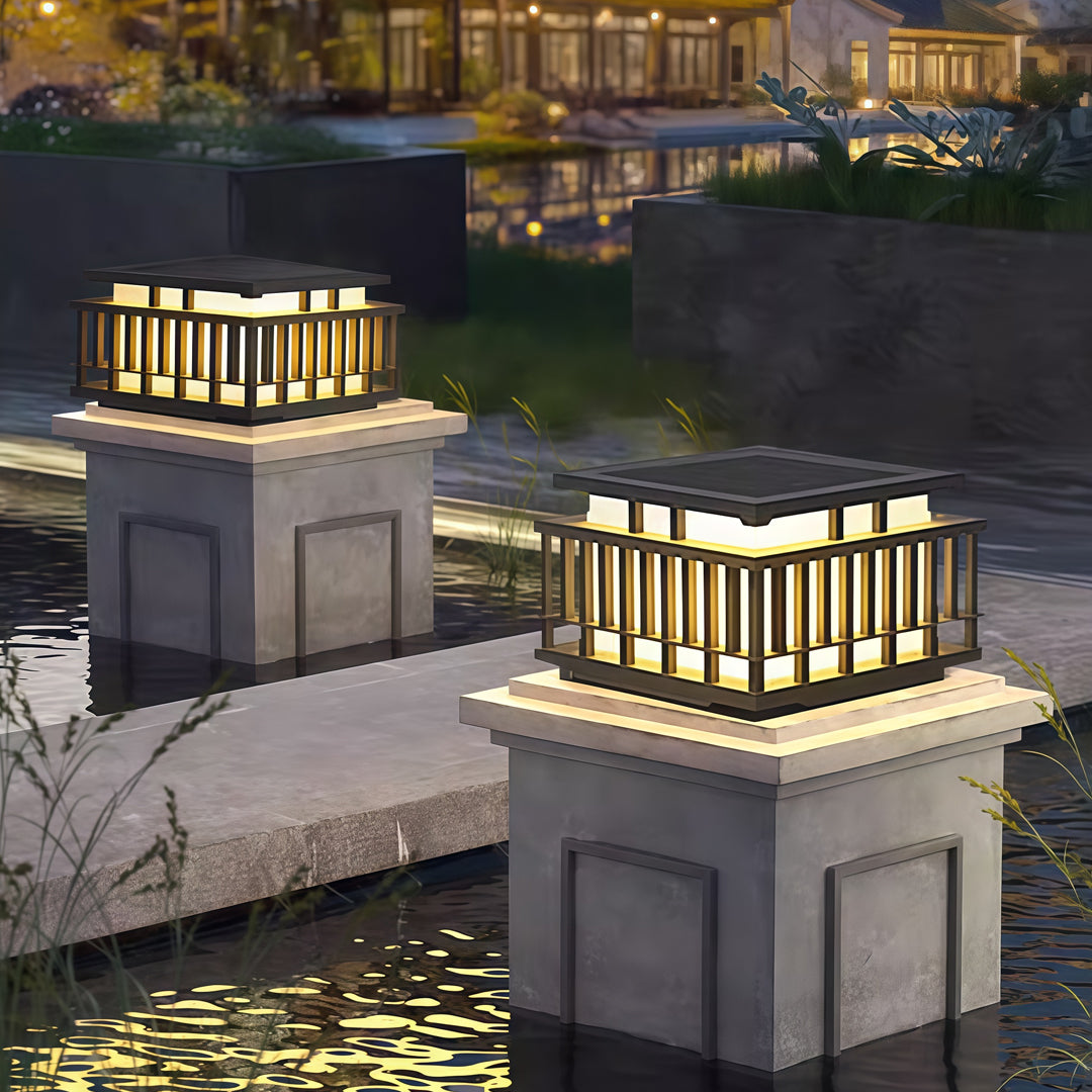 Contemporary outdoor wall lighting pillar mounted light in sleek black with vertical illuminated bar elements