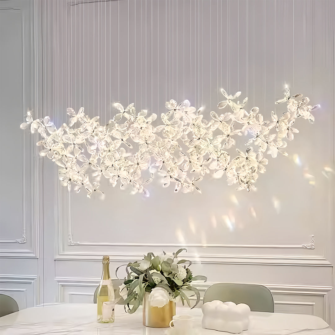 Contemporary rock crystal chandelier featuring natural branch silhouette in sophisticated interior setting