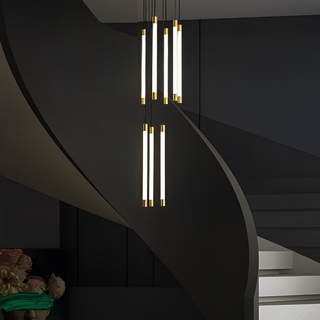 Contemporary staircase chandelier casting soft light over a classic wooden staircase and hallway.