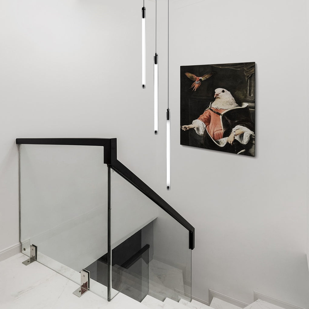 Contemporary staircase chandelier with vertical lights, creating a striking contrast in a modern home.