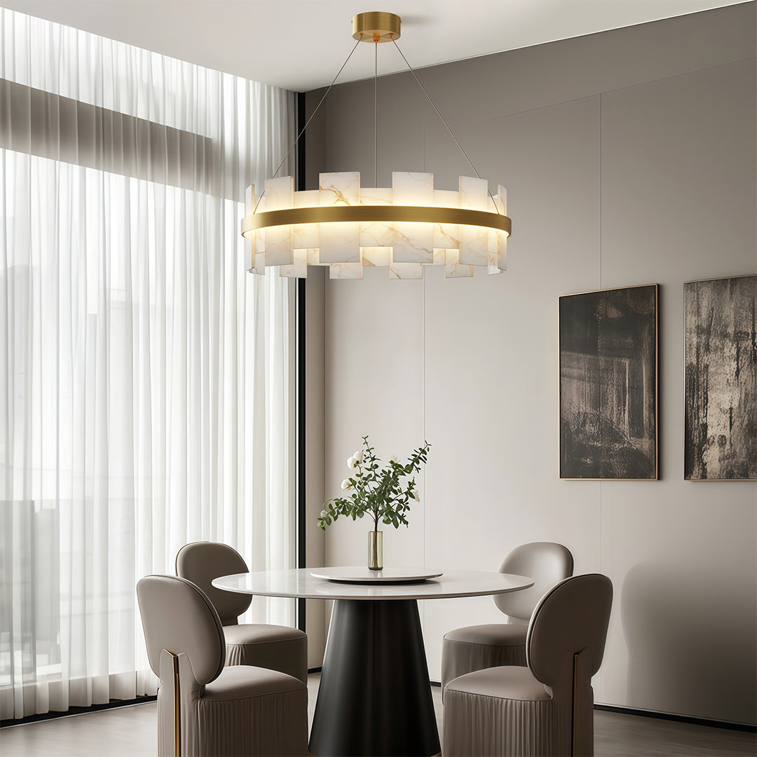 Copper modern chandelier creating ambient lighting in contemporary dining space with sheer curtains