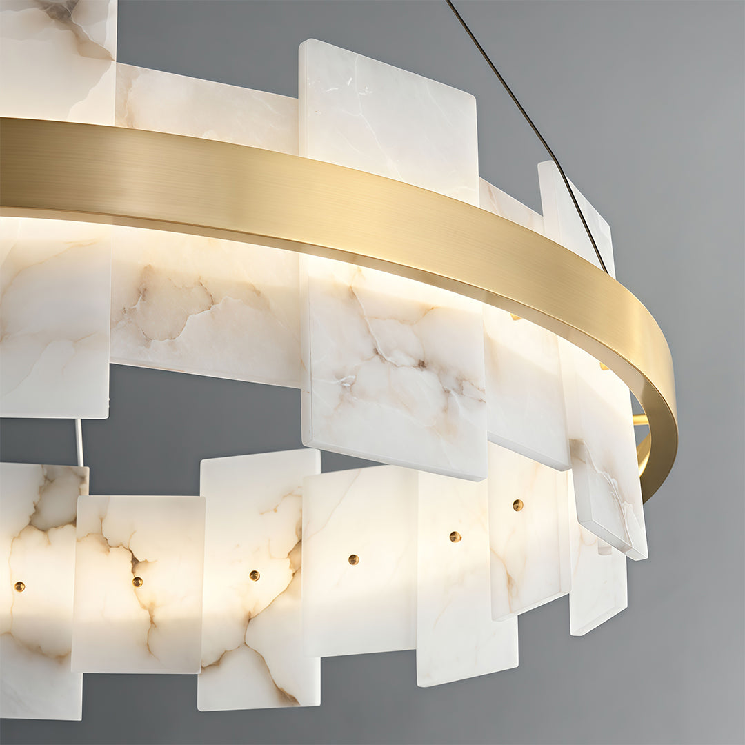 Modern luxury chandeliers close-up showcasing curved brass frame and layered acrylic detail