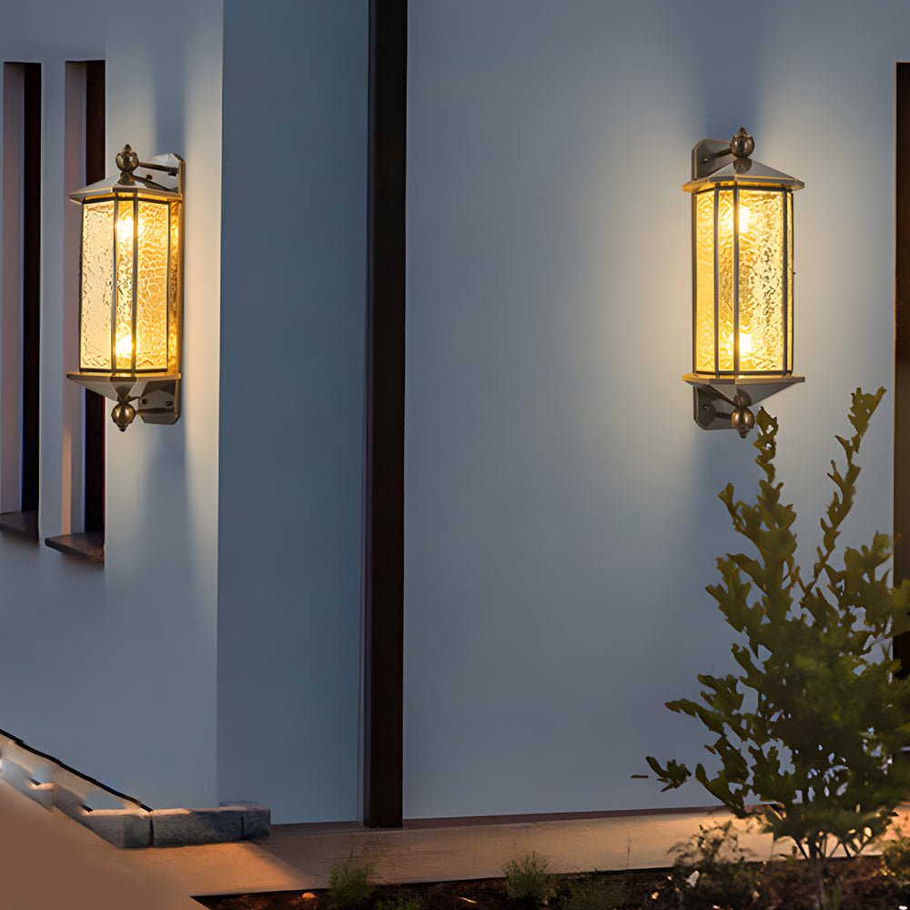 Single copper outdoor wall lantern mounted on a minimalist exterior wall, highlighting architectural lines with warm light.