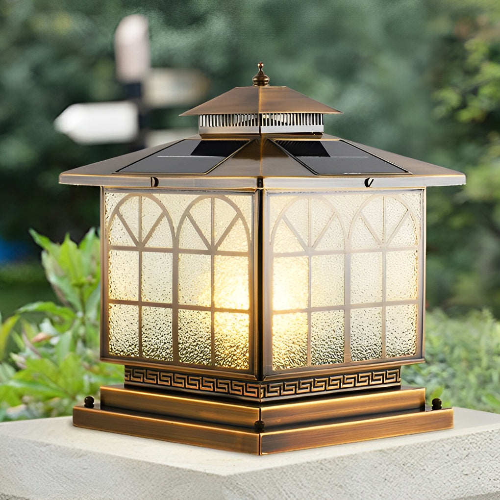 Copper pillar lights illuminating a modern outdoor entrance with classic charm.