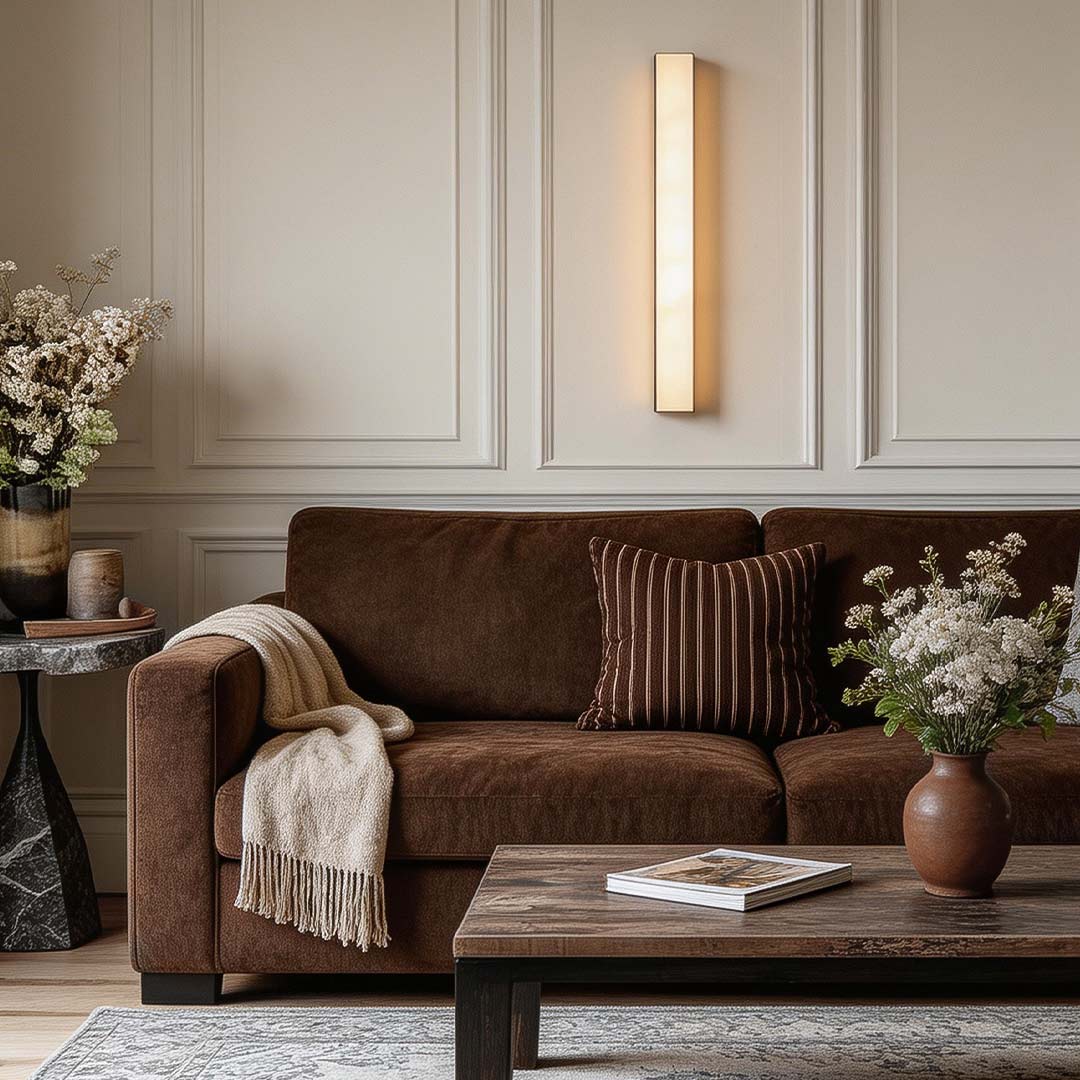 Copper sconce indoor with a minimalist design, providing ambient light in a stylish interior.