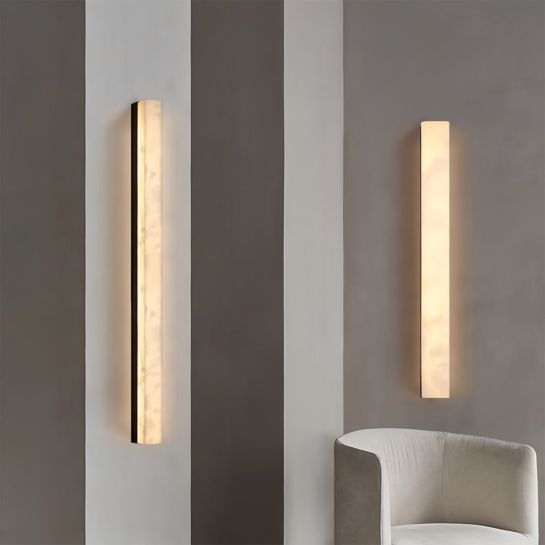 Copper sconce indoor lighting arrangement featuring multiple fixtures in contemporary living room design