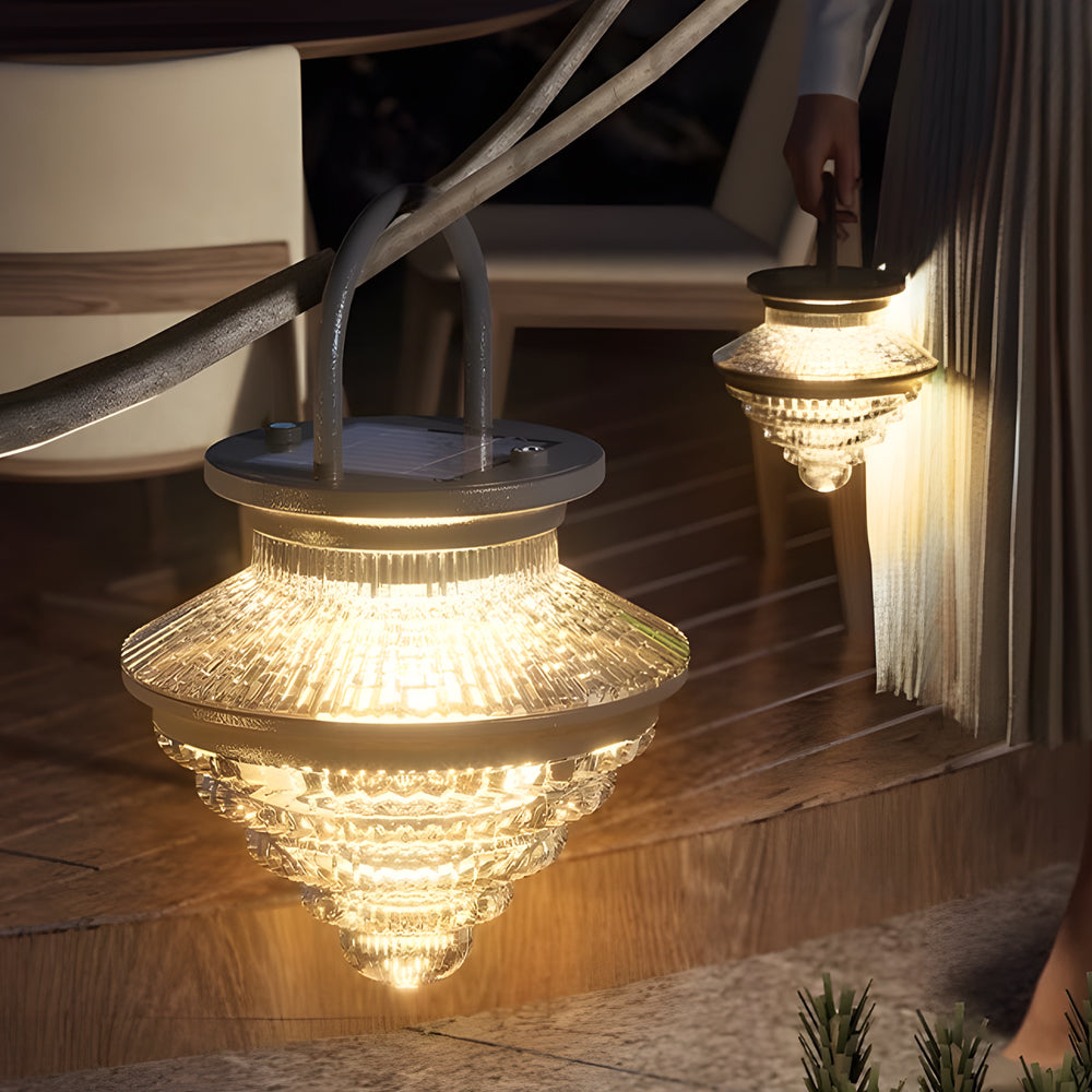 Cordless acrylic hanging lantern placed near stairs, casting layered light for safe and stylish outdoor use.