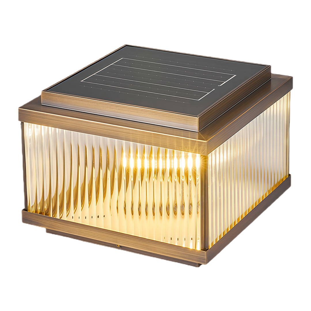 Decorative copper pillar light with vertical corrugated pattern creating ambient outdoor lighting effect.