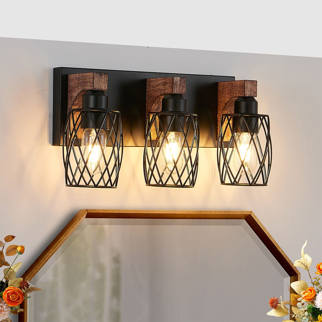 Black vanity bathroom light with three bulbs, installed above a mirror in a cozy bedroom setting.