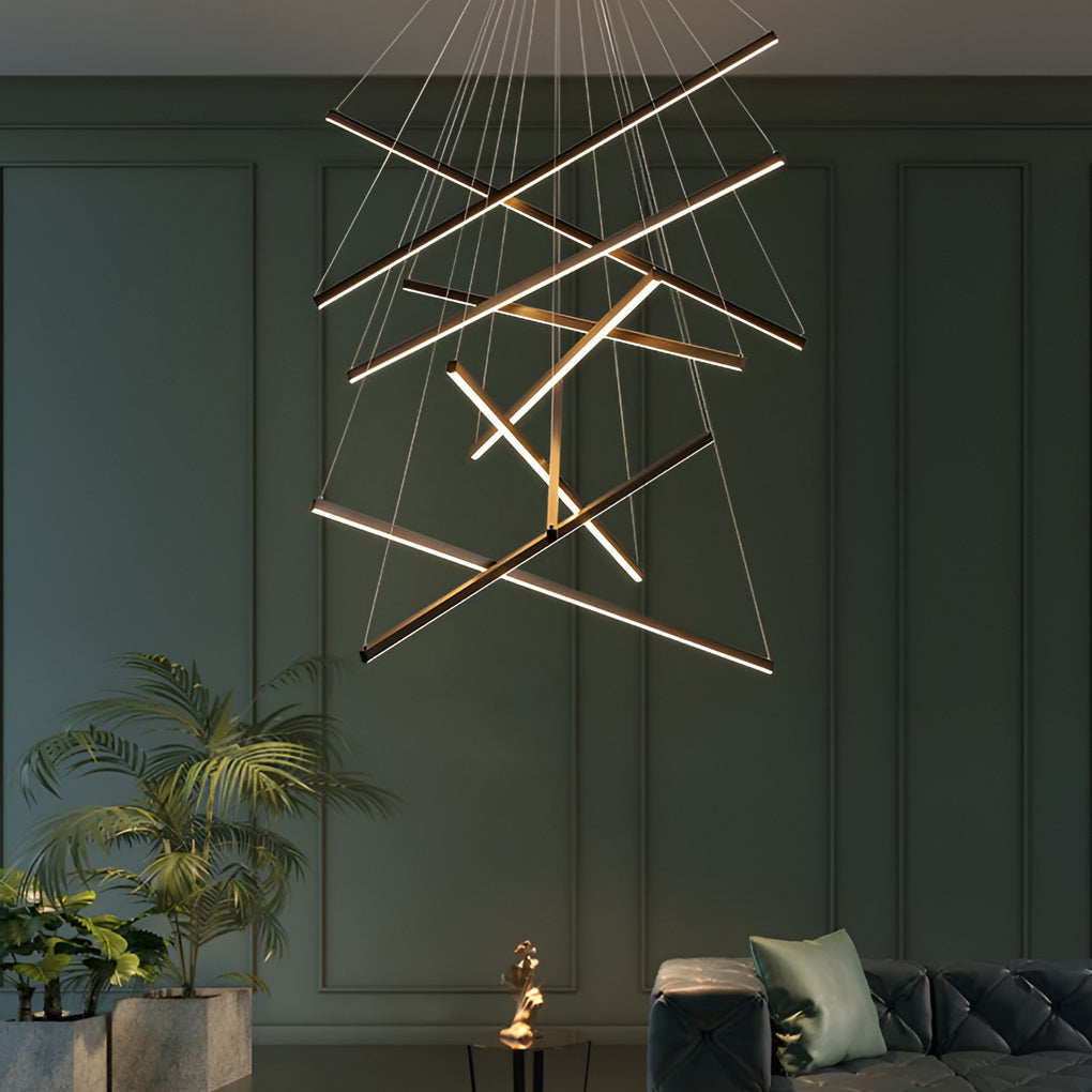 Criss linear chandelier with gold and black finish, adding a touch of elegance to a stylish living room.