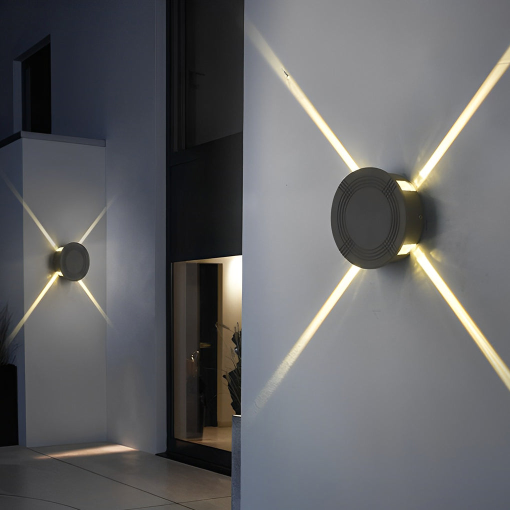 Cross light beams wall sconce providing directional light beside a modern door.