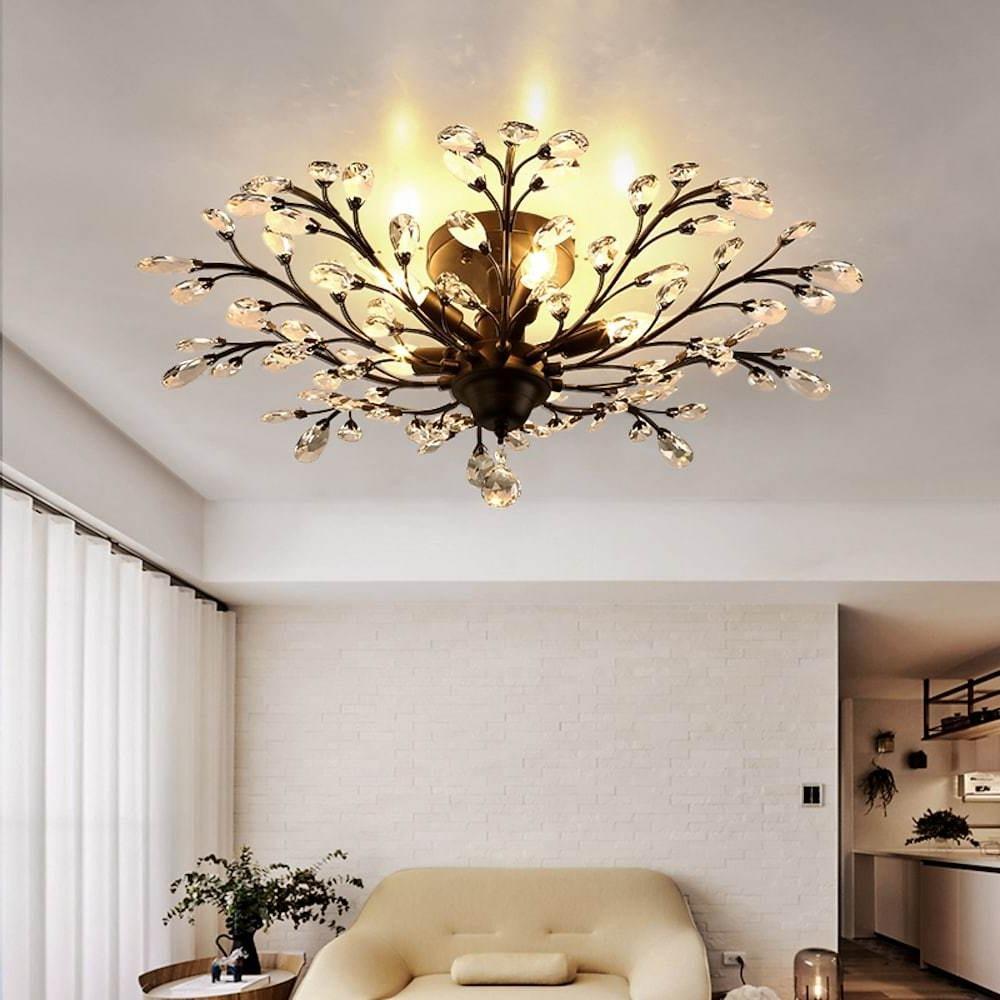 Crystal branch chandelier installed in minimalist living room with soft lighting.