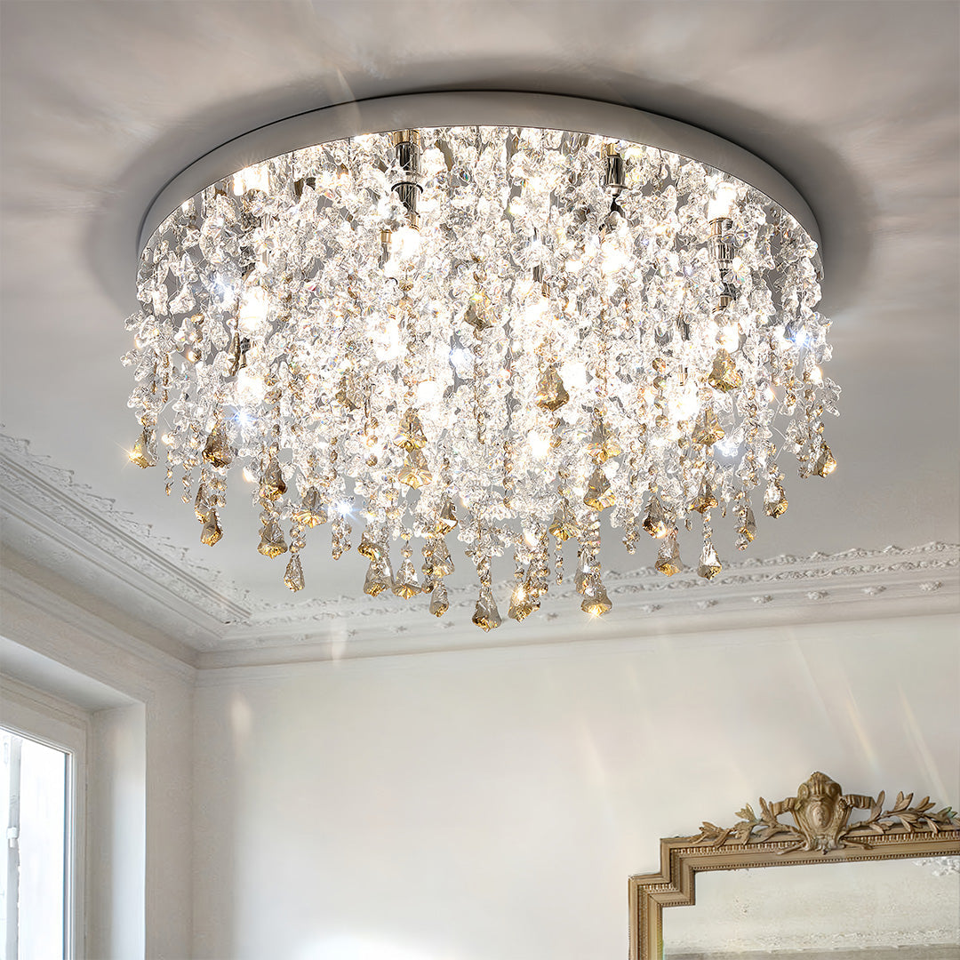 Unique crystal chandelier installed on white ceiling in classic elegant room with crown molding