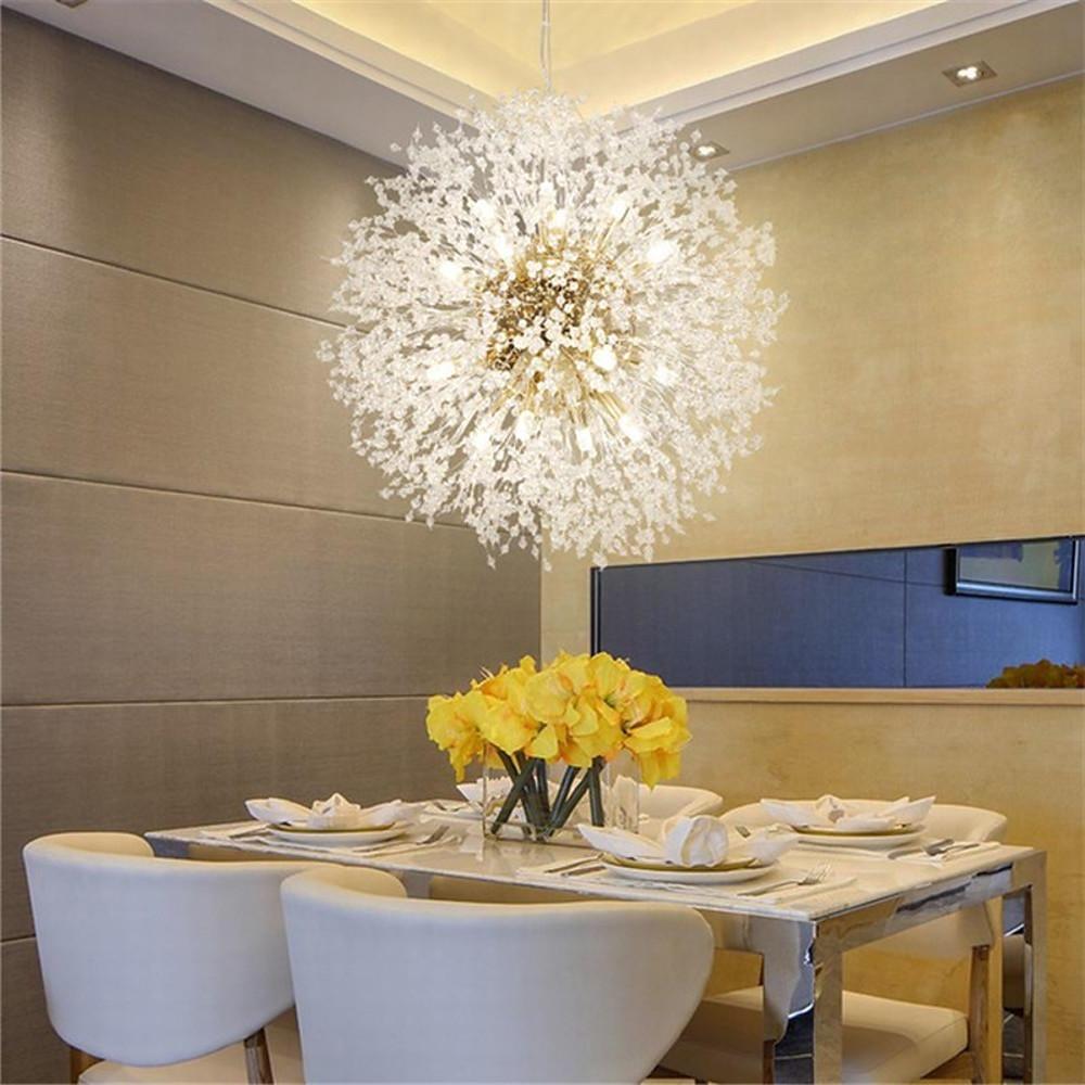 Crystal dandelion chandelier casting a gentle glow in a chic dining room.