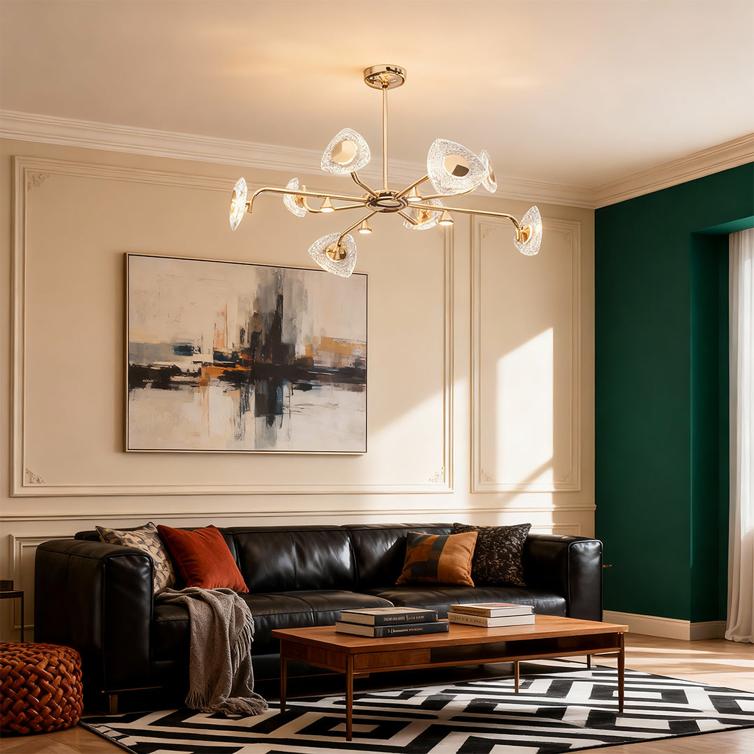 Crystal vintage chandelier creating focal point in contemporary living room with green accent wall and modern decor