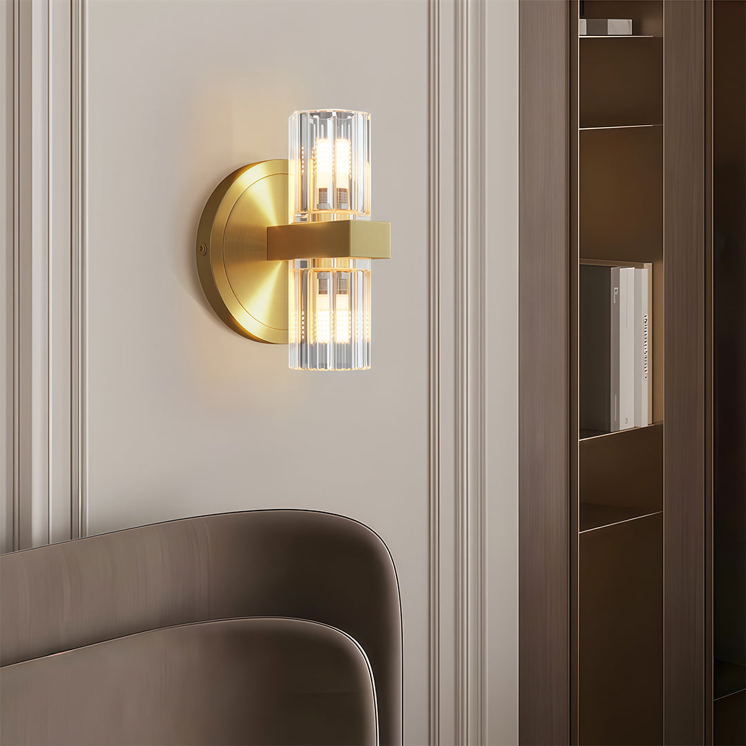 Crystal wall light providing ambient lighting in cozy reading nook with brown chair
