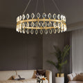Crystorama chandeliers over a modern dining table with soft lighting.