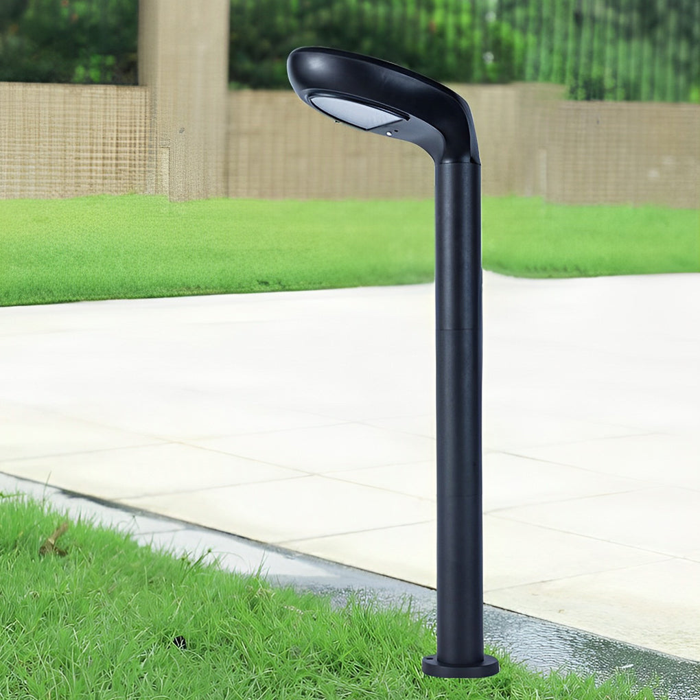 Outdoor curved bollard light installed near lawn and concrete edging.