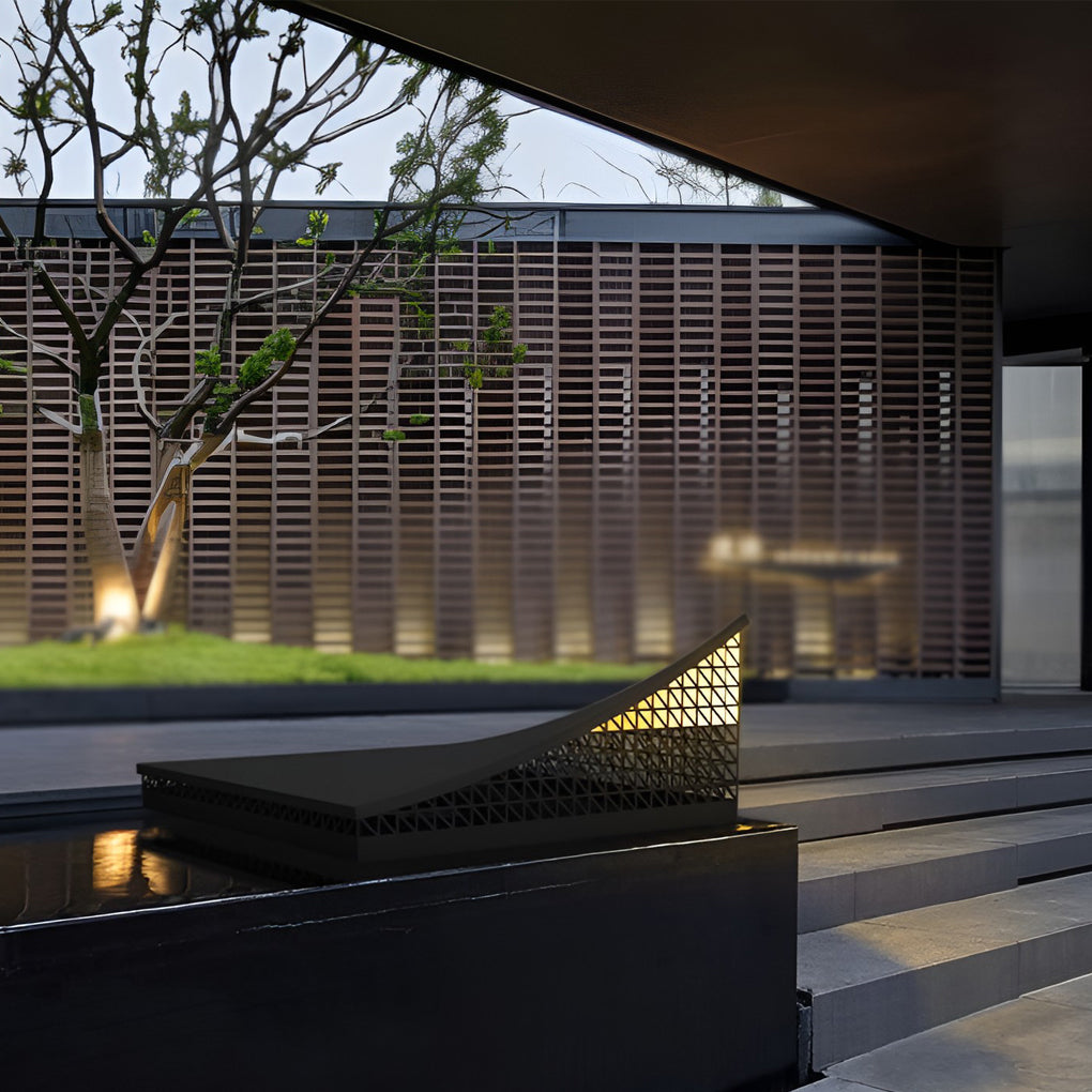 Curved landscape light providing a cozy glow in a modern garden setting.