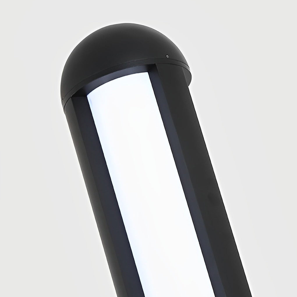 Tall garden bollard light with curved top design on garden pathway.