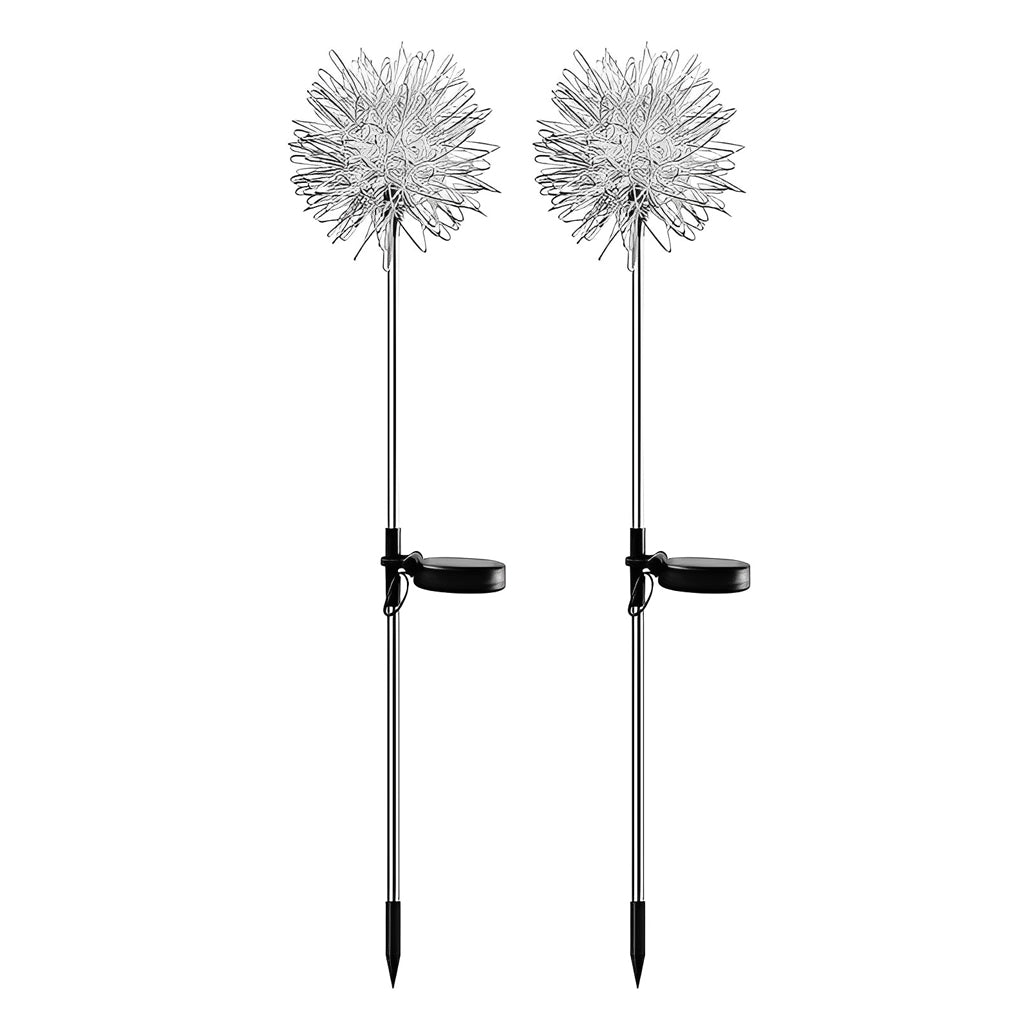 Dandelion landscape lights placed in a green shrubbery, providing a soft and natural outdoor glow.