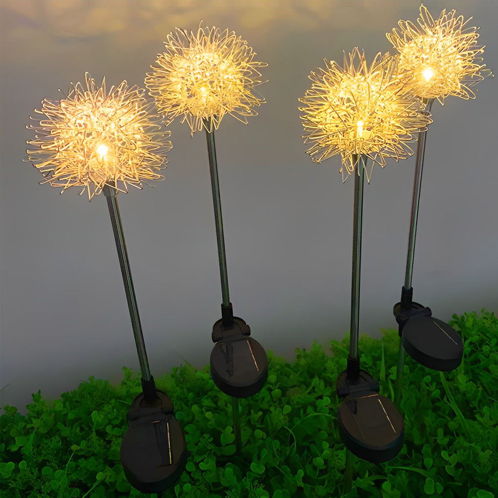Dandelion landscape lights with solar panels, arranged in a grassy area for ambient outdoor lighting.