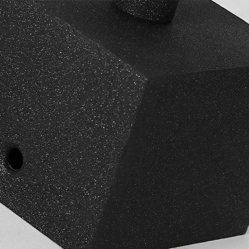 Decorative garden lighting base close-up showing textured surface and ground mounting detail.