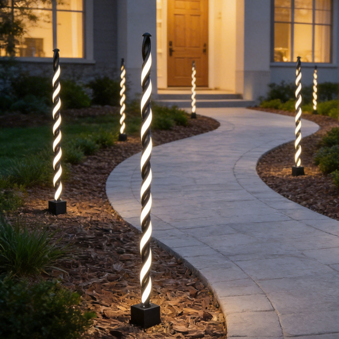 Decorative garden lighting installed along a curved garden path creating elegant nighttime guidance.