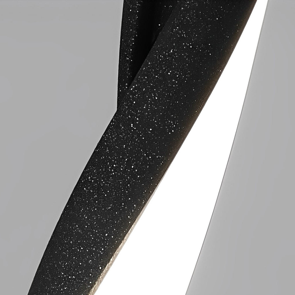 Decorative garden lighting body close-up highlighting twisted metal structure and illuminated strip.