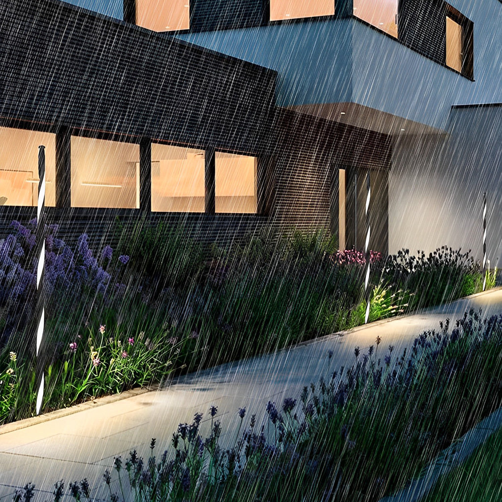 Decorative garden lighting shown under rain demonstrating outdoor waterproof performance.