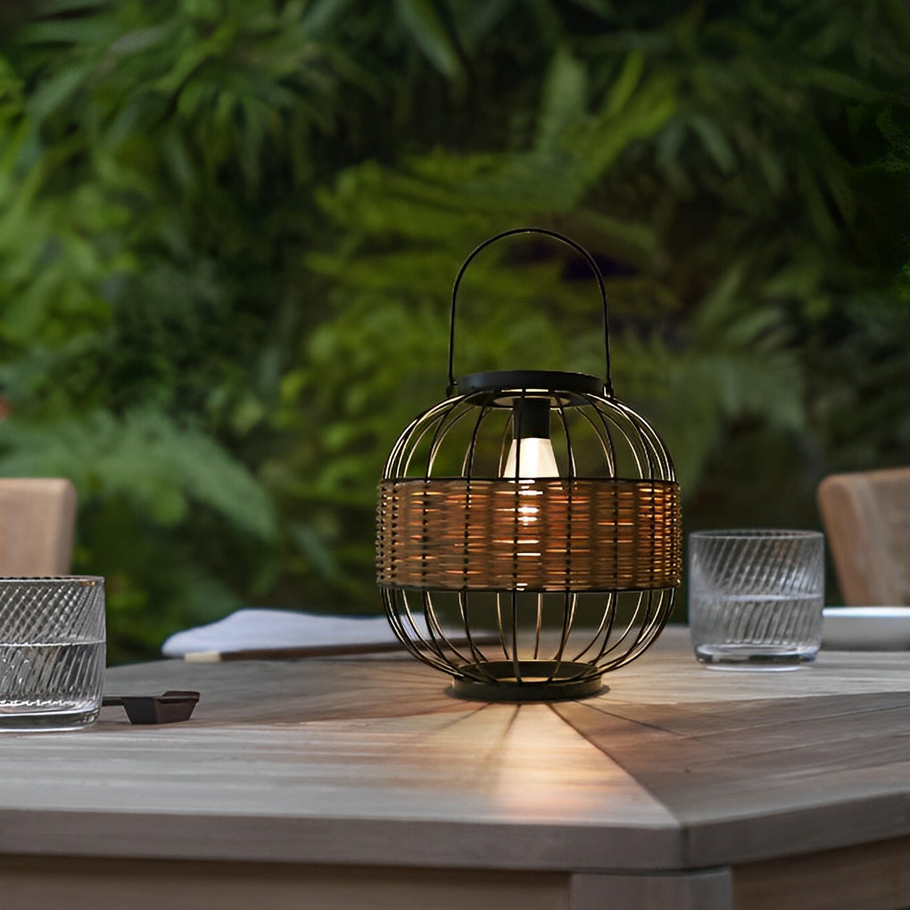 Decorative hanging solar lantern with a natural wicker finish, providing ambient light in a garden.