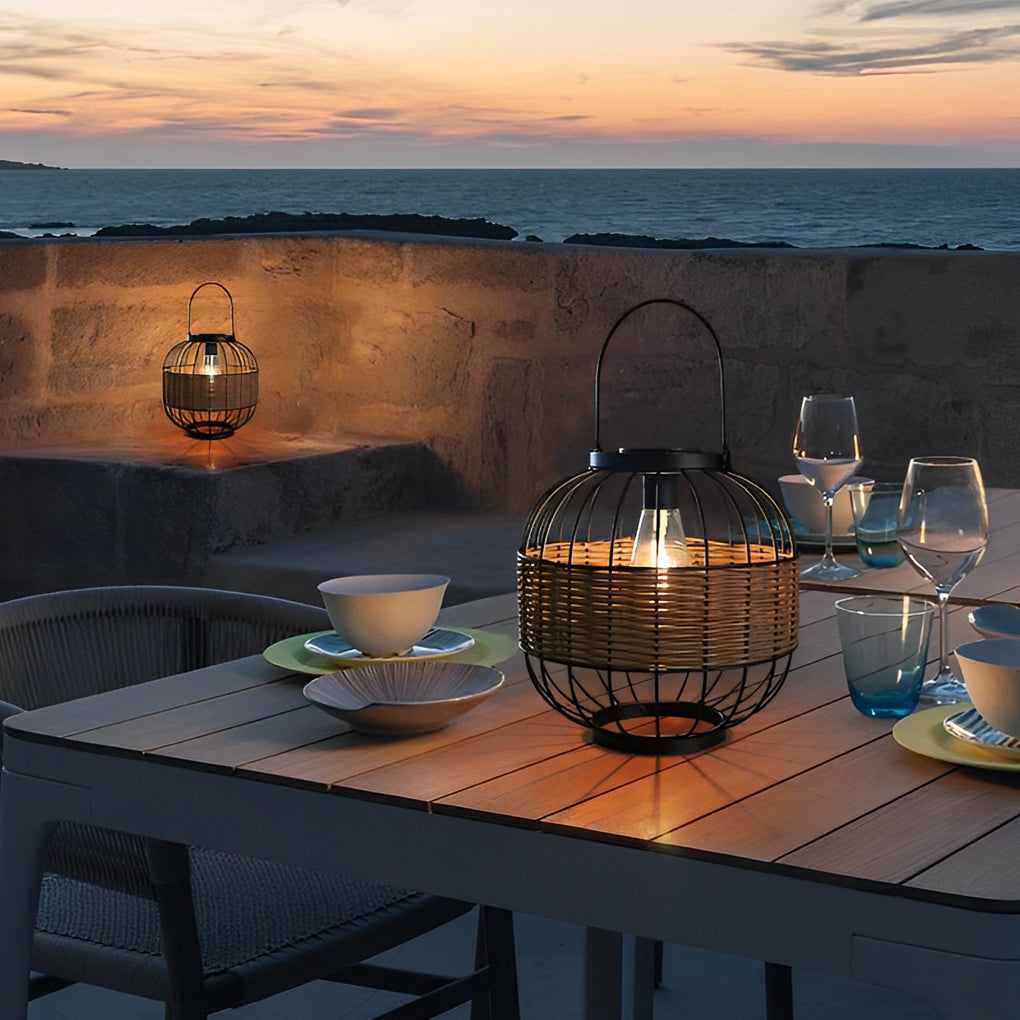 Decorative hanging solar lantern with a stylish wicker pattern, placed on an outdoor dining table.