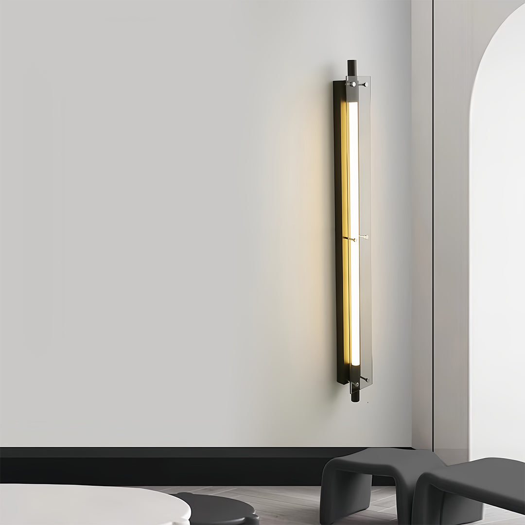 Single vertical led wall strip lights used as decorative accent lighting in a minimalist living room.