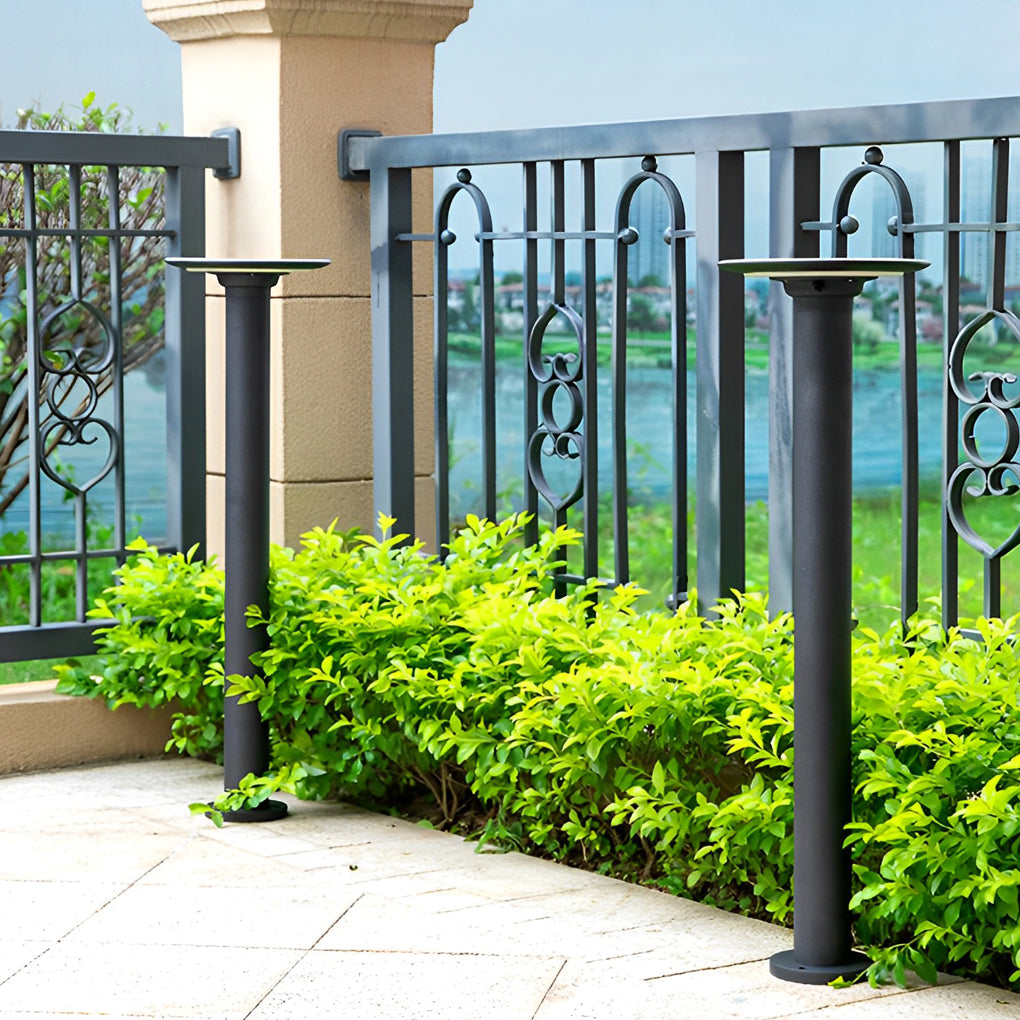Decorative solar path lights lining a terrace railing with greenery, adding safety and visual appeal to outdoor spaces.