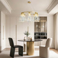 Designer contemporary crystal chandelier featuring glass shade chandelier aesthetic illuminating bright Scandinavian-style kitchen dining area.