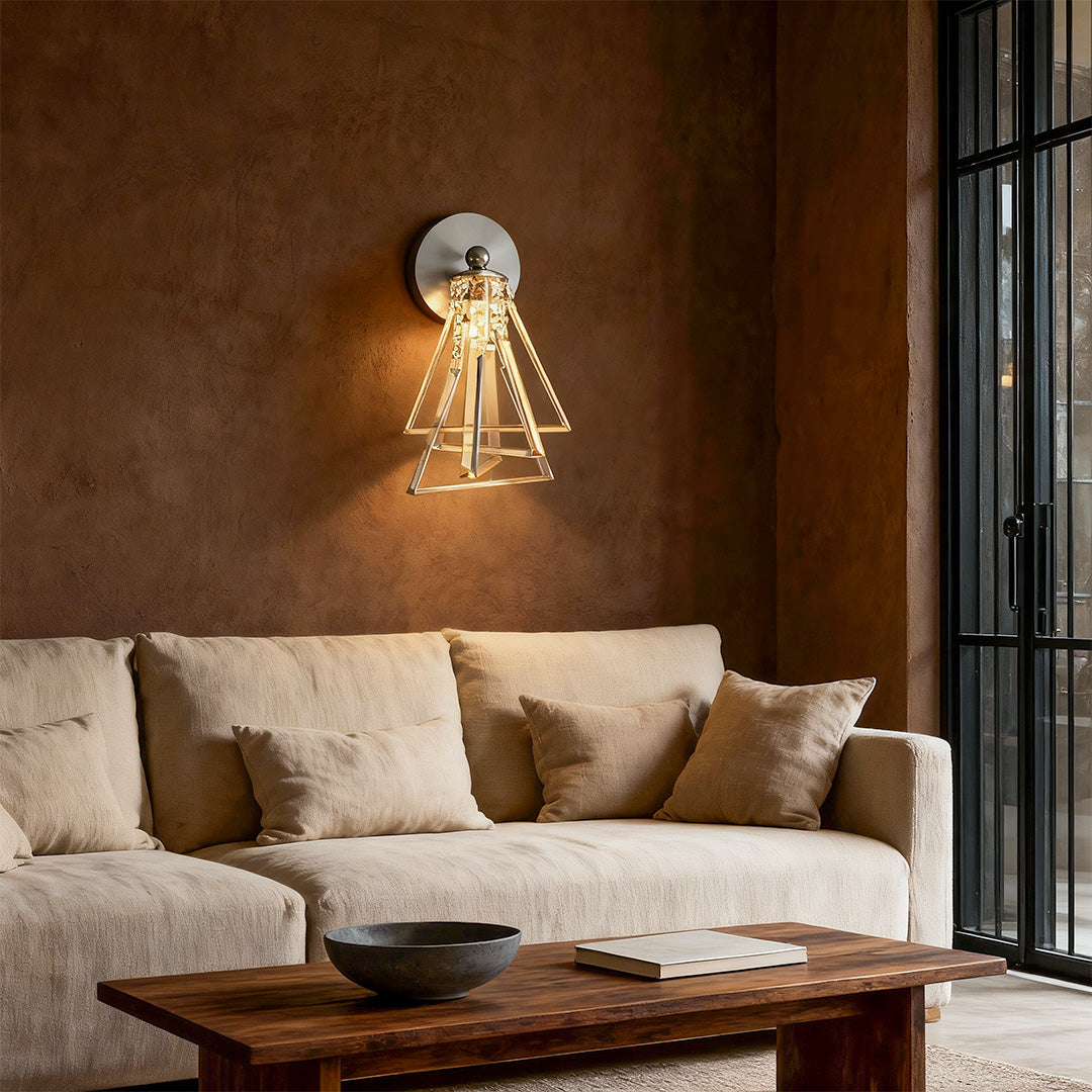Designer crystal wall lights featuring glass shade chandelier aesthetic providing ambient lighting in luxurious brown-toned bedroom.
